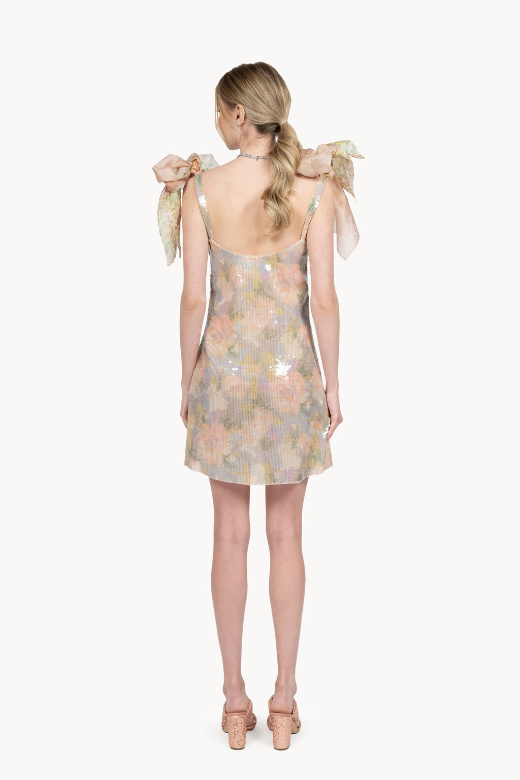 Mini abito con paillettes stampate e fiocchi