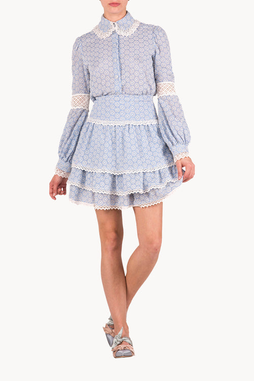 Blusa in cotone con occhielli e pizzi
