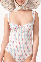 Costume intero con fantasia floreale e a righe