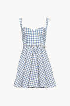 A light blue and white gingham mini dress with a sweetheart neckline, thin shoulder straps, a matching fabric tie belt with a silver buckle, and a flared skirt, shown against a plain off-white background.
