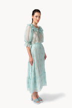 Blusa in chiffon ricamata con colletto a volant