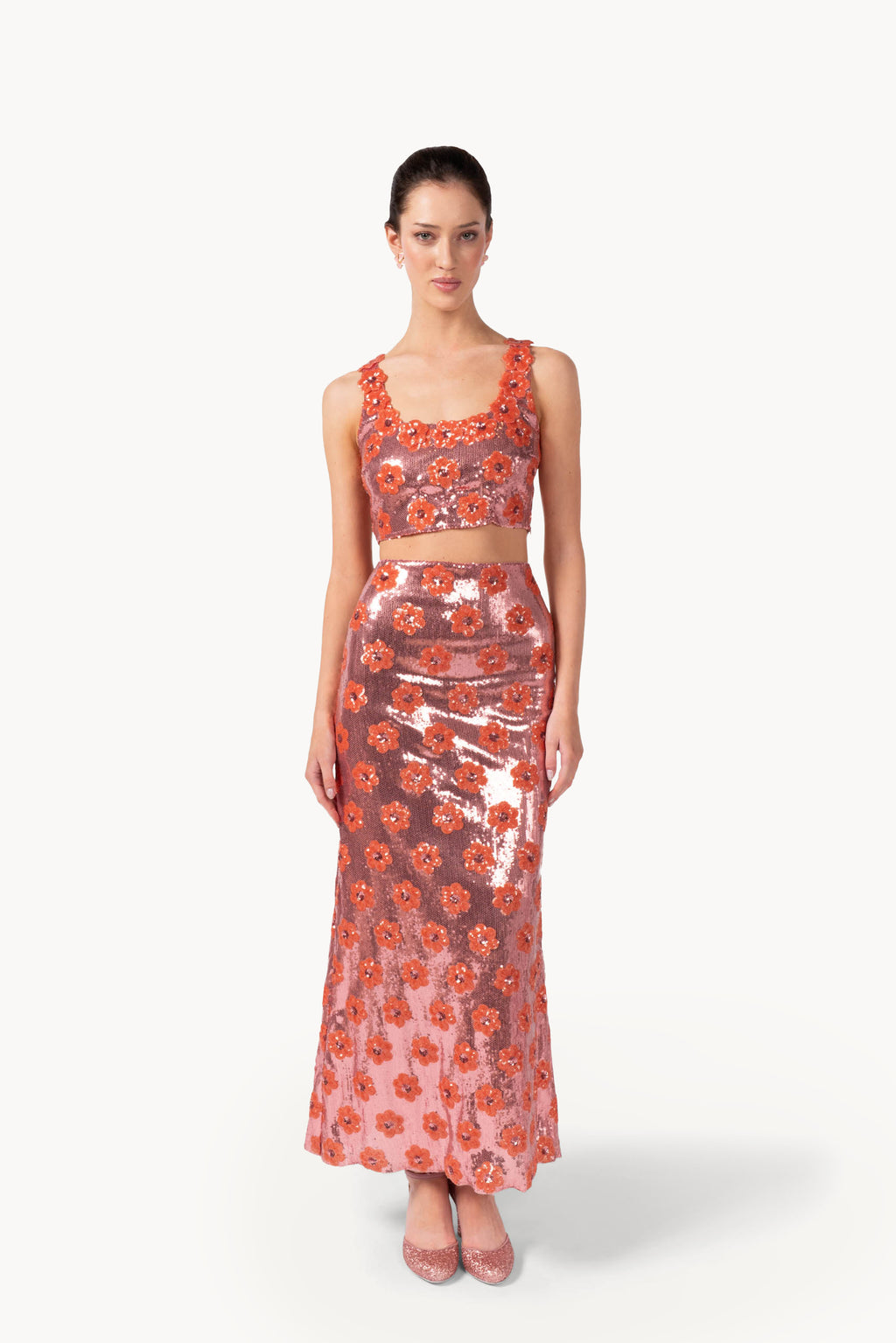 Top rosa con margherita e paillettes