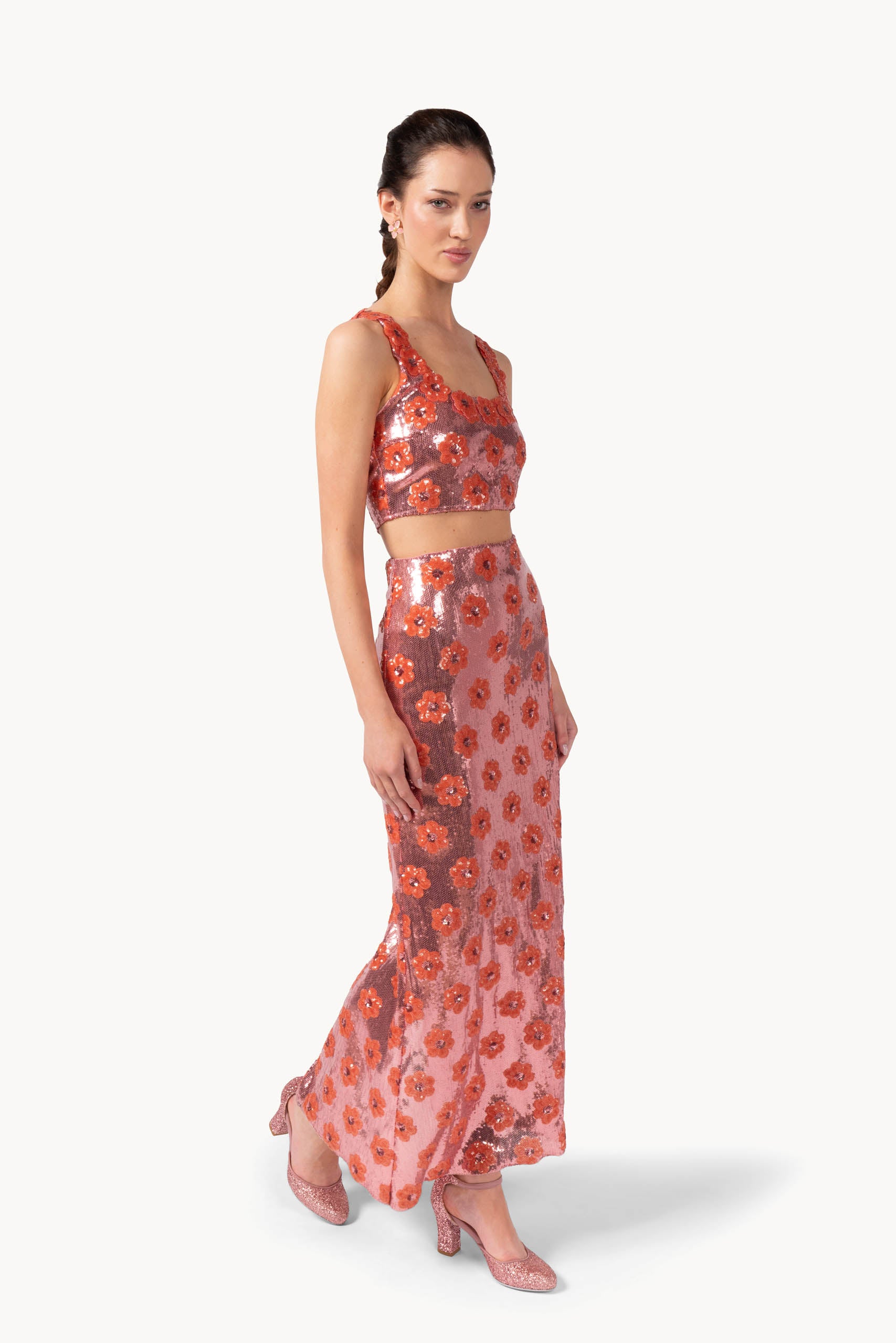 Top rosa con margherita e paillettes