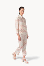 Pantaloni in cotone plumetis floreale e a righe