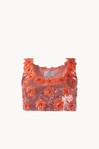 Top rosa con margherita e paillettes