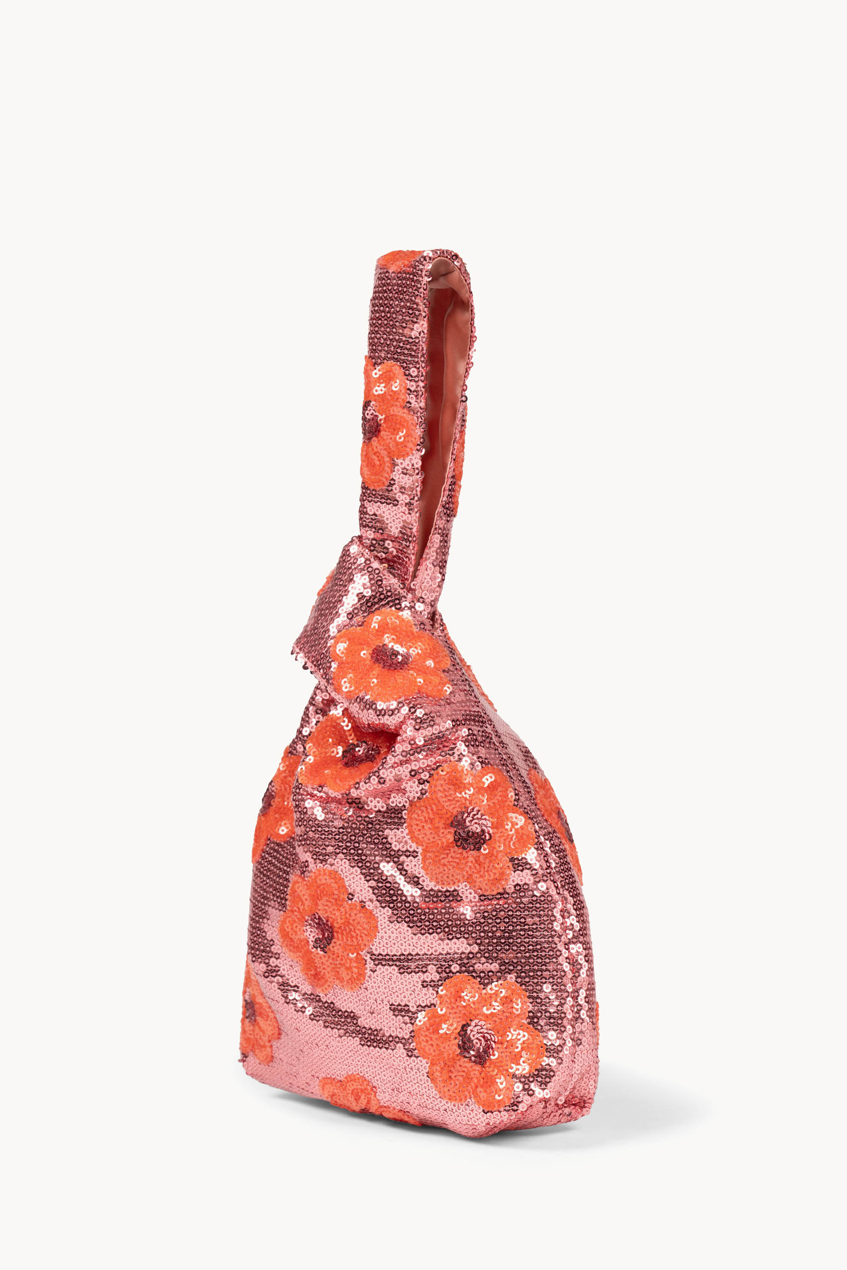 Clutch rosa con margherita e paillettes da portare a mano