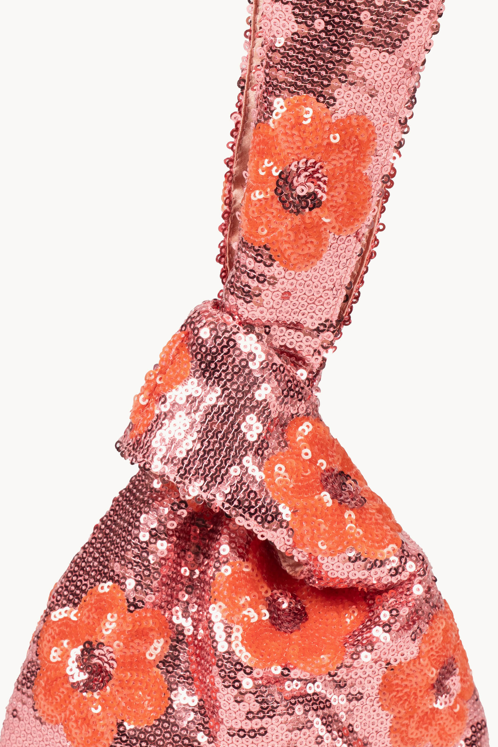 Clutch rosa con margherita e paillettes da portare a mano