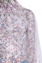 Blusa a collo alto in tulle ricamato