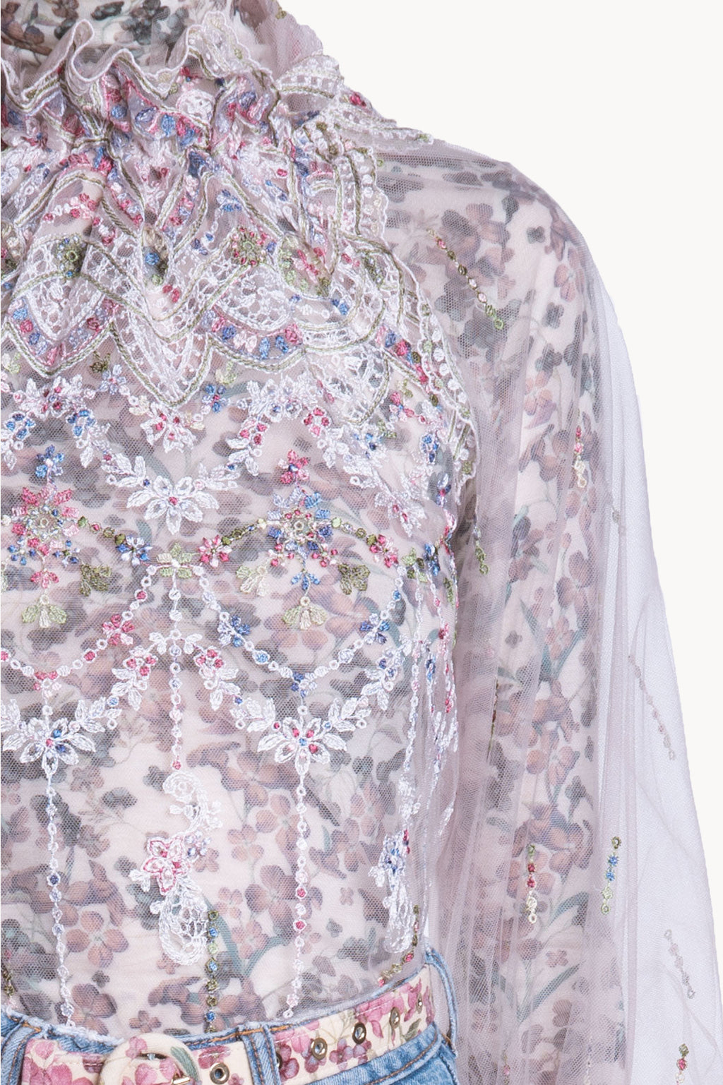 Blusa a collo alto in tulle ricamato