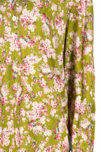 Polo in jersey verde con boccioli di rosa stampati