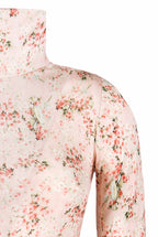 Dolcevita in jersey rosa con boccioli di rosa stampati