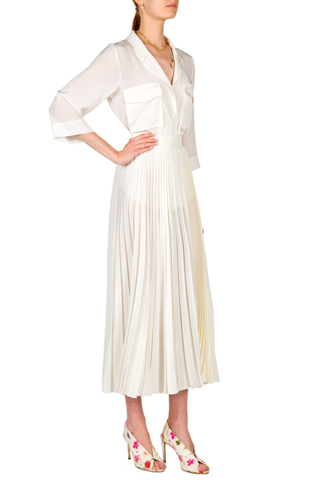 Top in crepe con tasche applicate