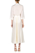 Top in crepe con tasche applicate