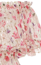 Tuta con stampa floreale, pizzo e spalle scoperte