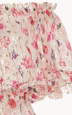 Tuta con stampa floreale, pizzo e spalle scoperte