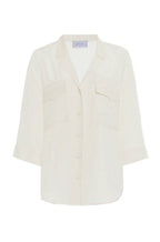 Top in crepe con tasche applicate