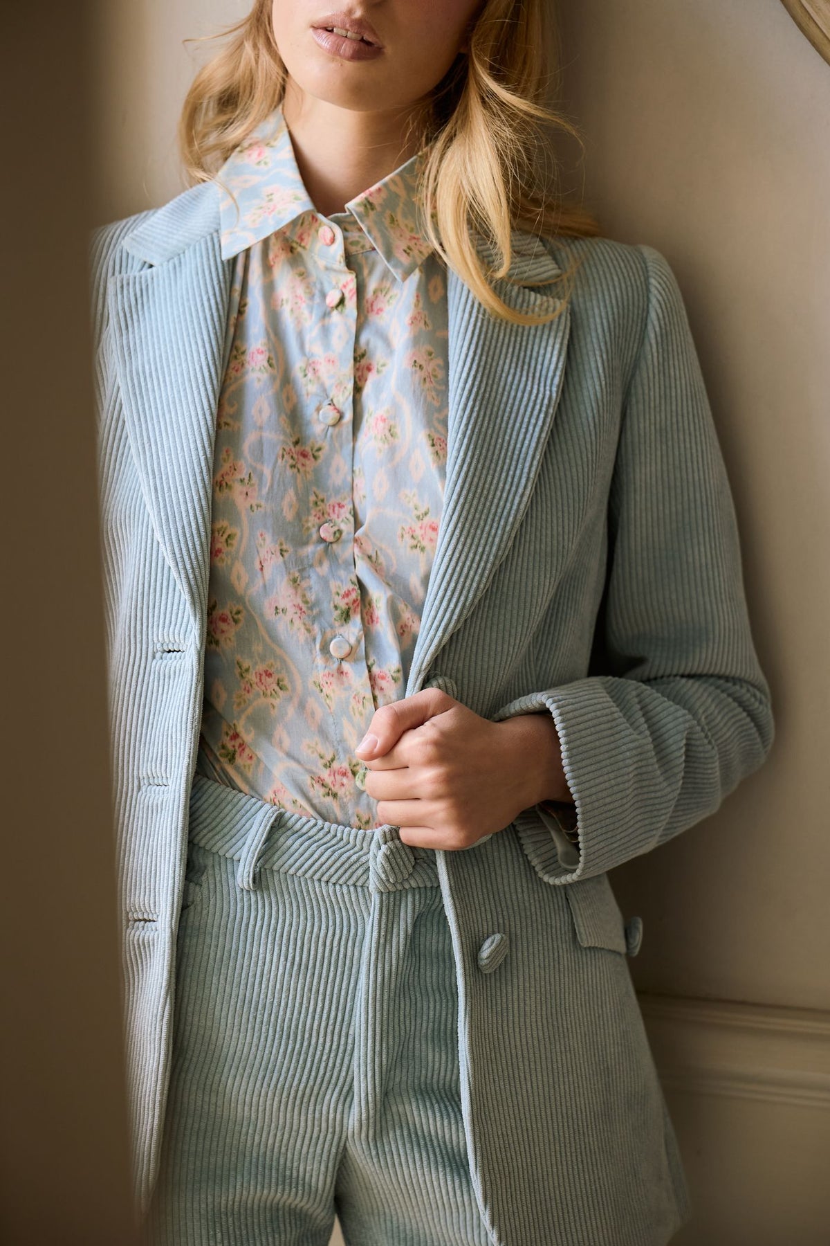 Pale blue corduroy double-breasted jacket and trousers with a floral shirt